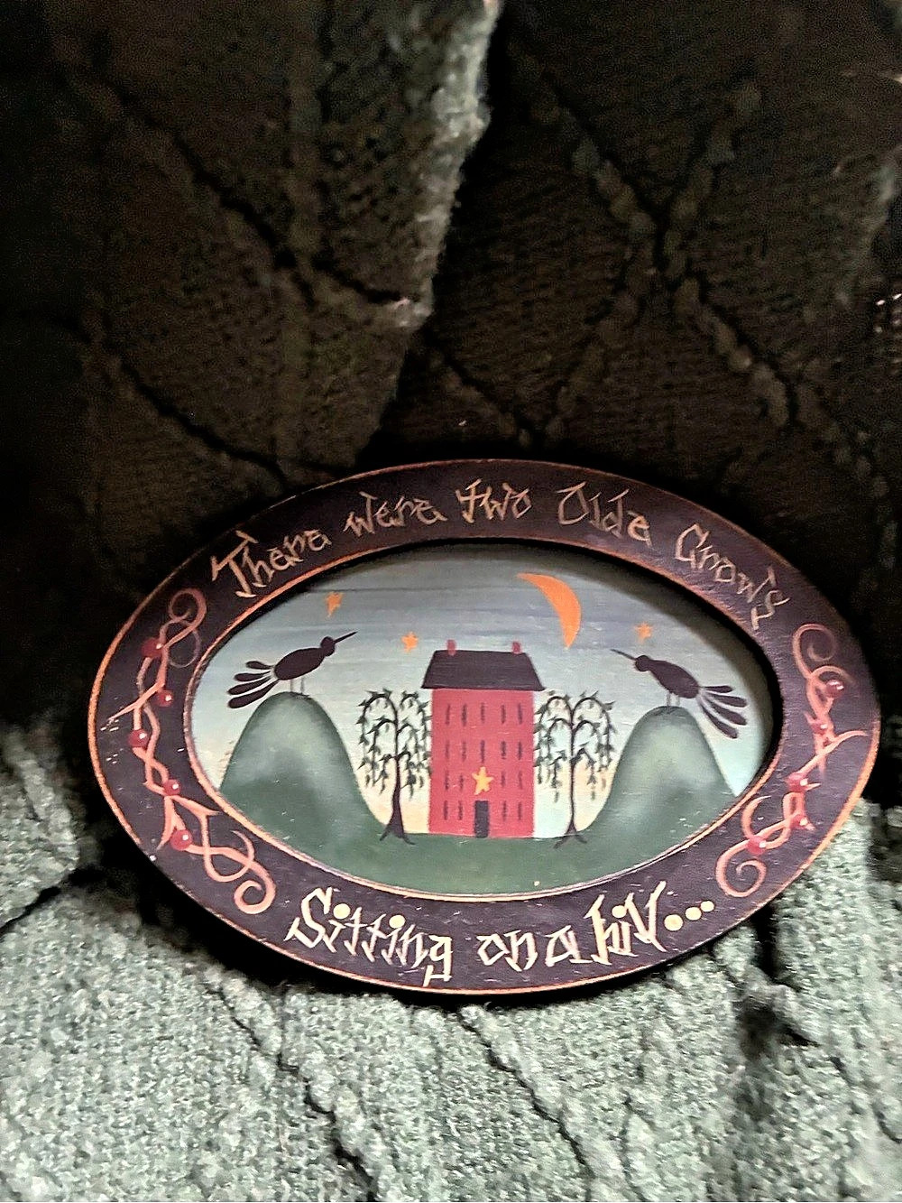 Primitive small oval wall decor.